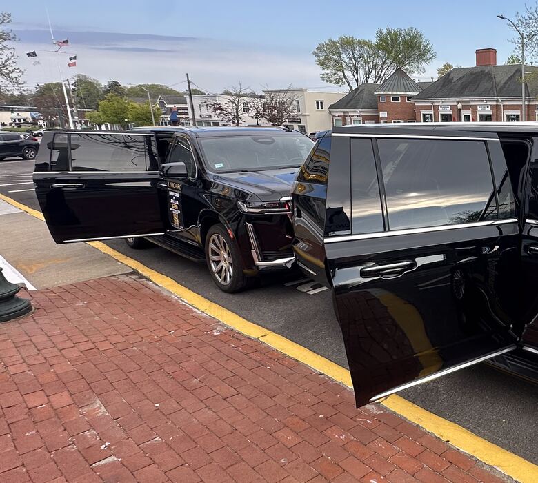 Cadillac Escalade waiting curbside for an airport pickup on Long Island